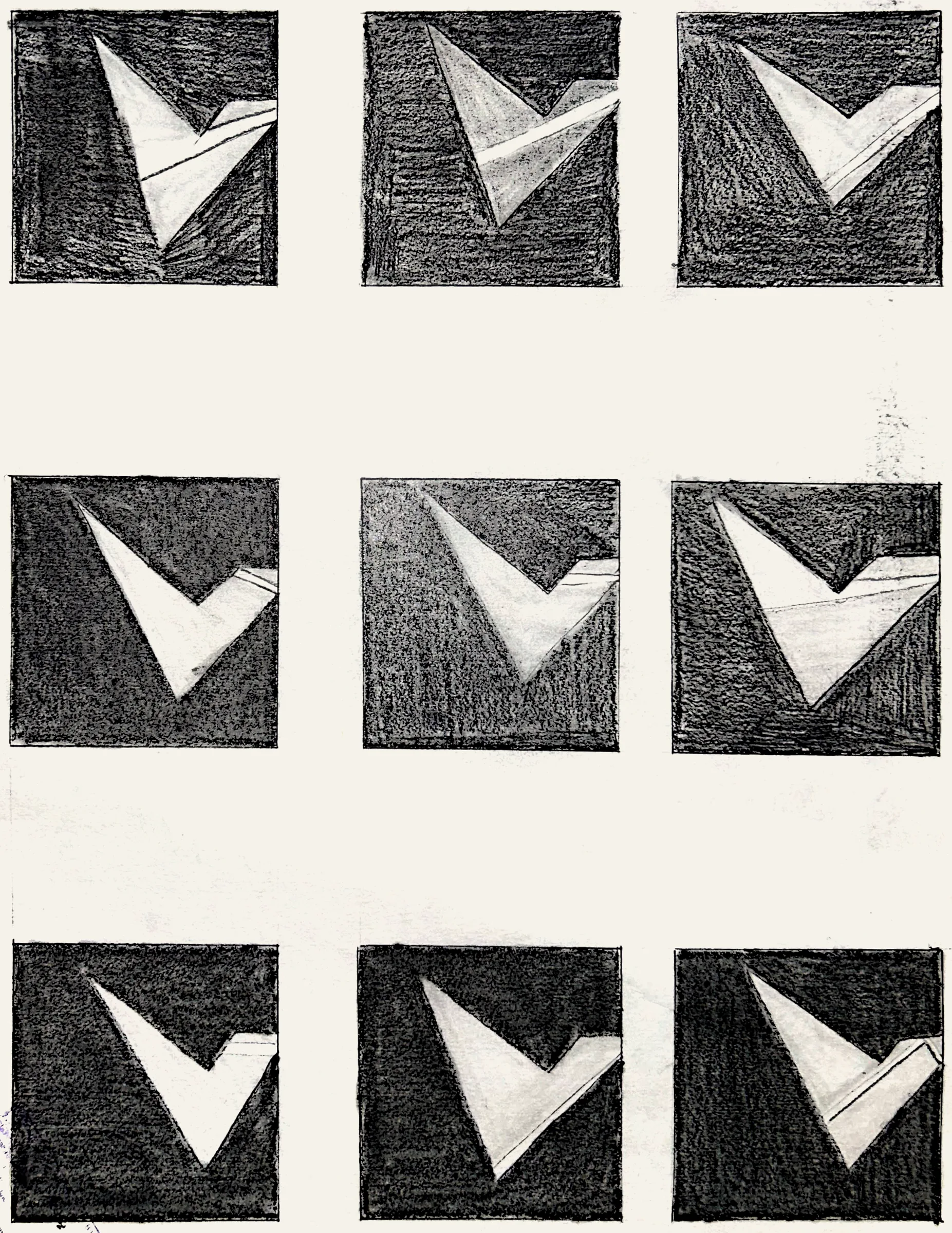 Positive and negative space: nine charcoal-pencil squares, each with a white folded V-form cut out of the dark ground