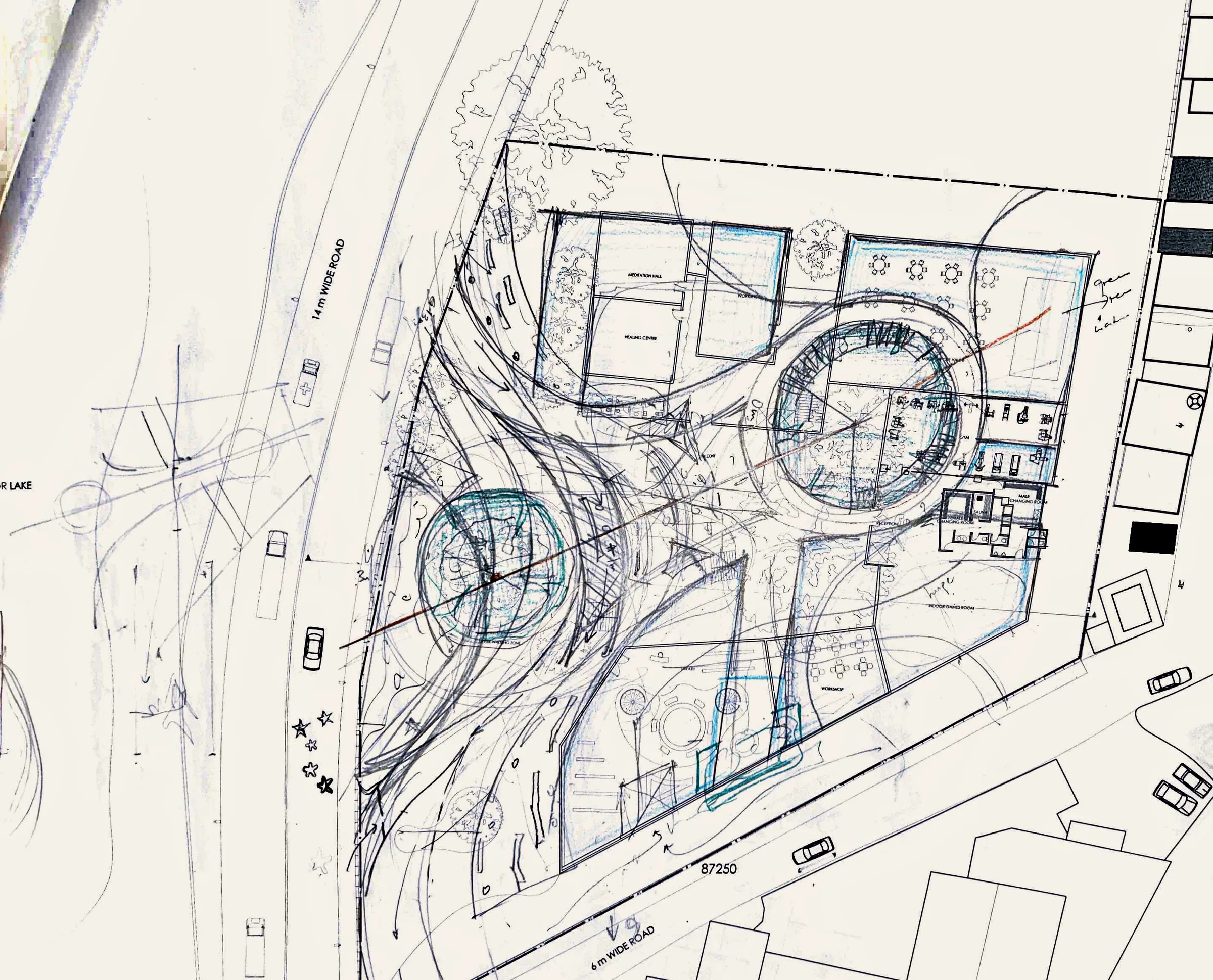 Iteration in pencil and blue pencil over the site plan: two circular courts linked by sweeping curved paths that run from the road into the site, with blocks around them.