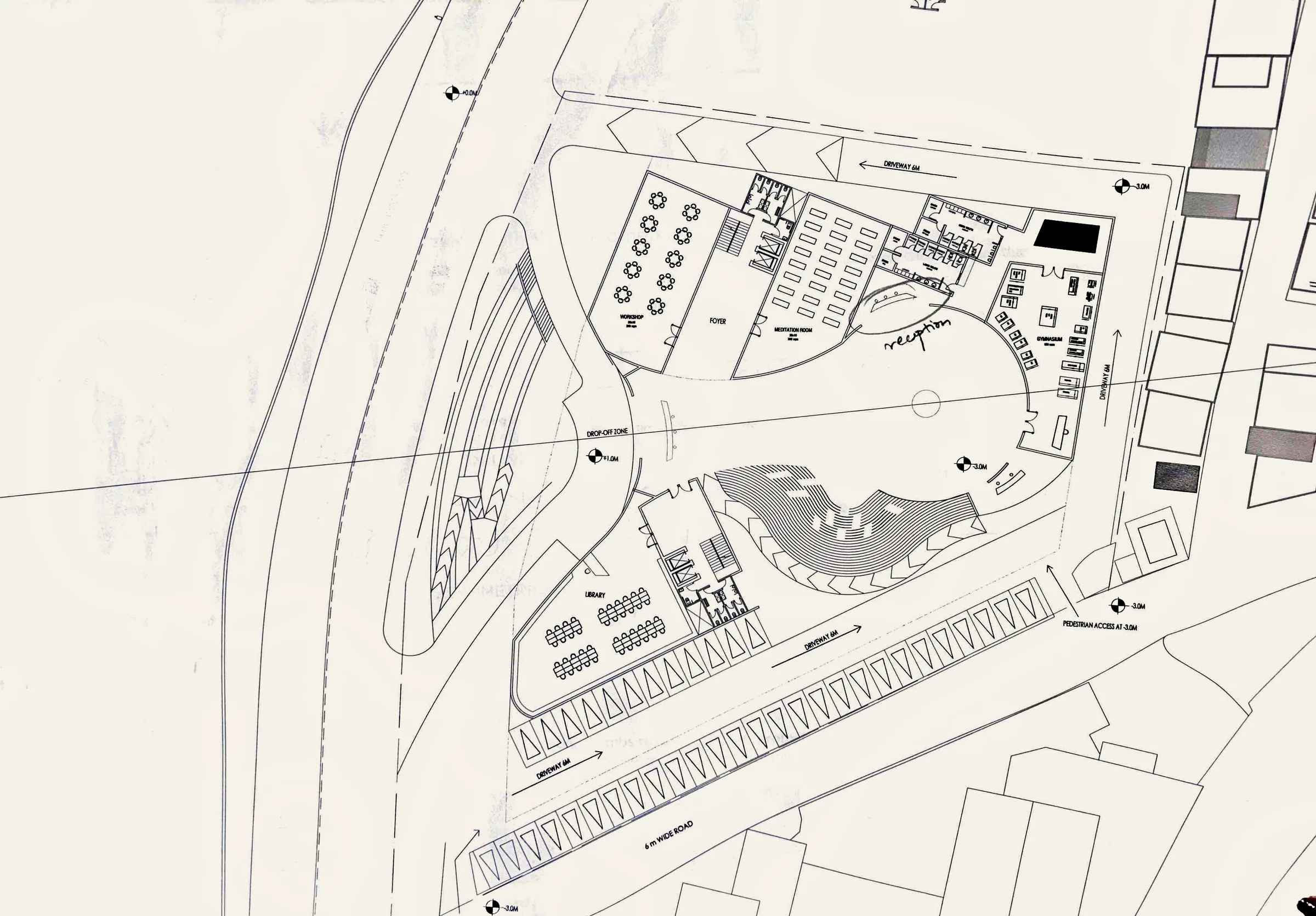 Developed ground plan: a central open court with a stepped amphitheatre, workshop and dining halls along one side, and a long zig-zag edge of parking along the road.